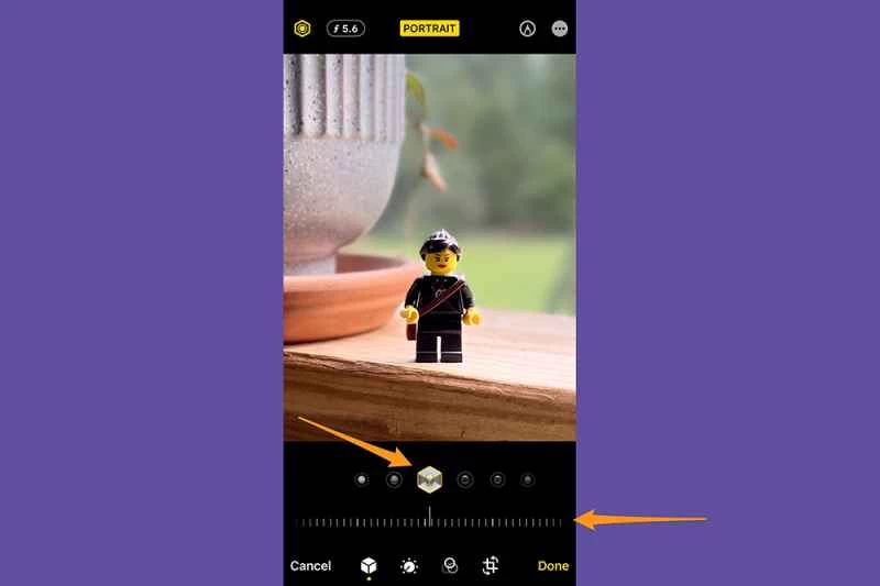 iPhone 照片應用程式處於編輯模式,示範如何編輯人像模式的光效。